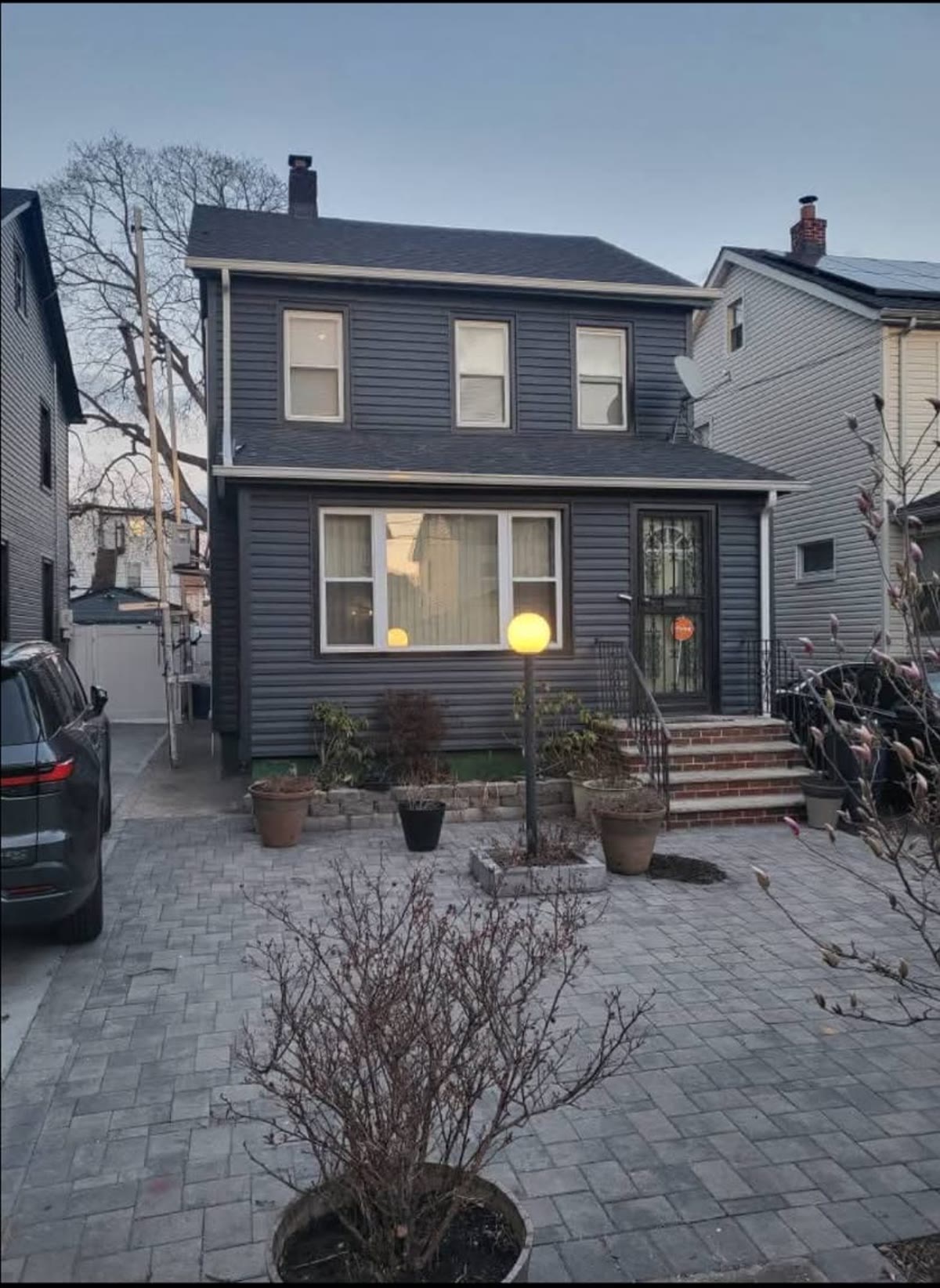 Same house finished with new charcoal vinyl siding